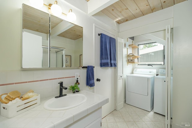 148 Ridgeway Ave, Fairfax, CA 94930 - full bathroom with wooden ceiling, separate washer and dryer, vanity, backsplash, and tile patterned floors