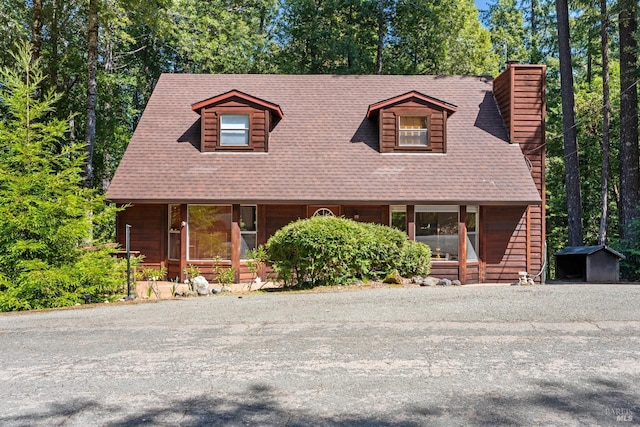 26228 Otter Dr, Willits, CA 95490 - rustic home featuring roof with shingles, a chimney, and covered porch