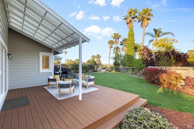 deck featuring a yard, a fenced backyard, and a pergola