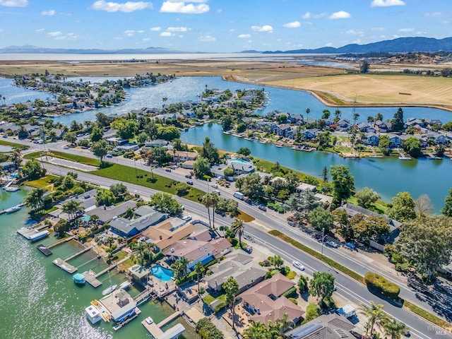 birds eye view of property featuring a water view and a residential view