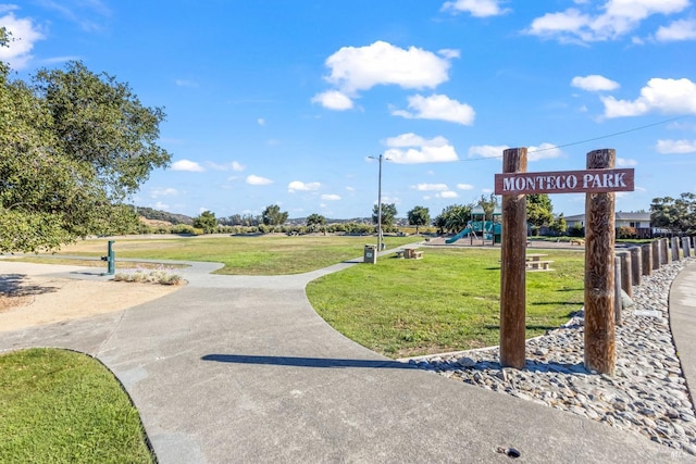view of community with a yard and playground community