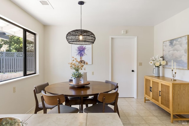 dining area featuring baseboards