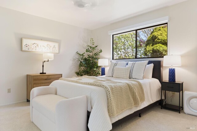 carpeted bedroom with baseboards