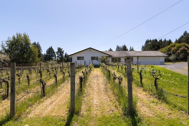 single story home with an attached garage, fence, and aphalt driveway