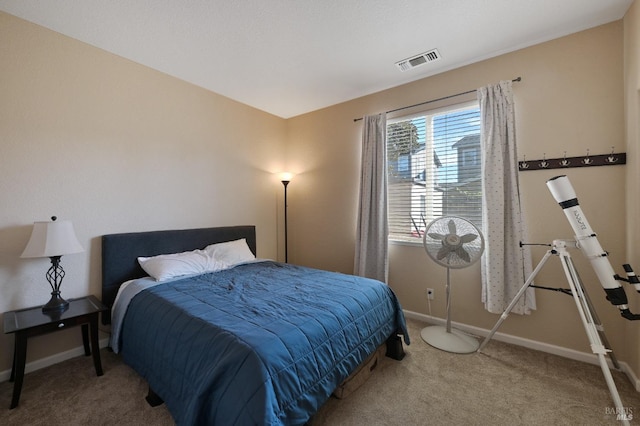 bedroom with visible vents, baseboards, and carpet floors