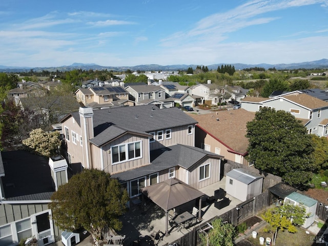 bird's eye view featuring a mountain view and a residential view