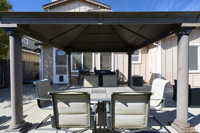 view of patio featuring a gazebo and fence