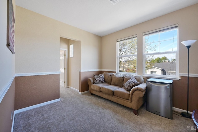 living area with carpet floors and baseboards