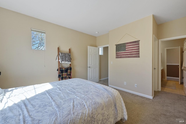 carpeted bedroom with baseboards