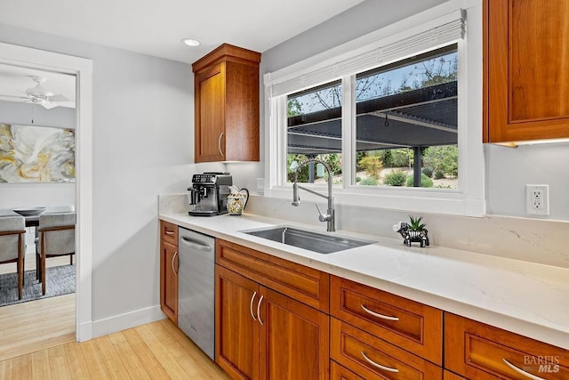 kitchen with recessed lighting, dishwasher, a ceiling fan, a sink, and light wood-style floors