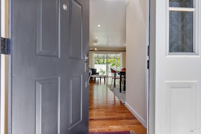 entryway featuring recessed lighting, baseboards, and wood finished floors