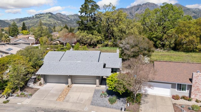 birds eye view of property with a mountain view