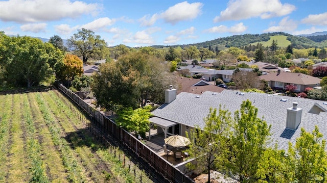 drone / aerial view featuring a residential view and a mountain view