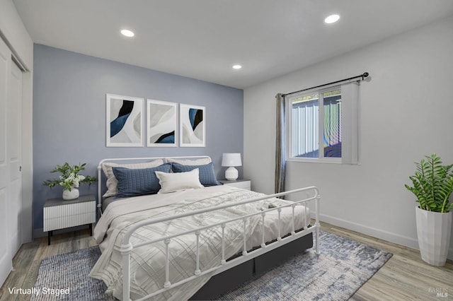 1464 Mcgregor Ave, Petaluma, CA 94954 - bedroom with wood finished floors, a closet, recessed lighting, and baseboards