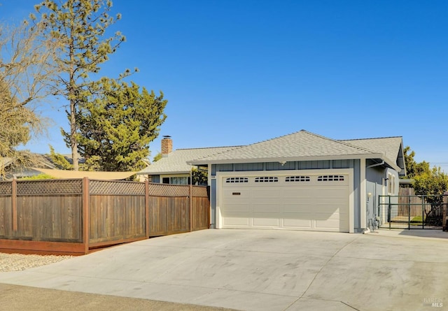 1464 Mcgregor Ave, Petaluma, CA 94954 - ranch-style home with concrete driveway, board and batten siding, an attached garage, a shingled roof, and a chimney