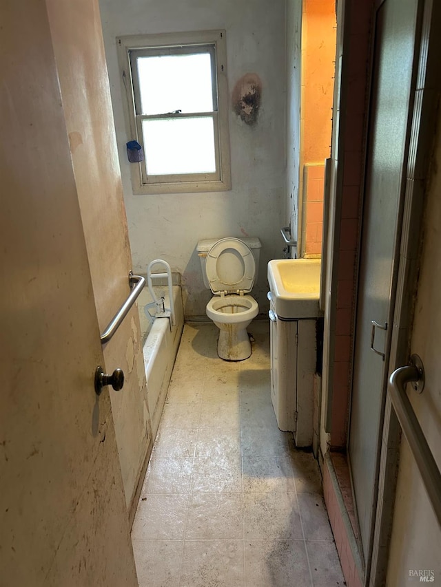 bathroom with walk in shower, vanity, toilet, and a tub to relax in