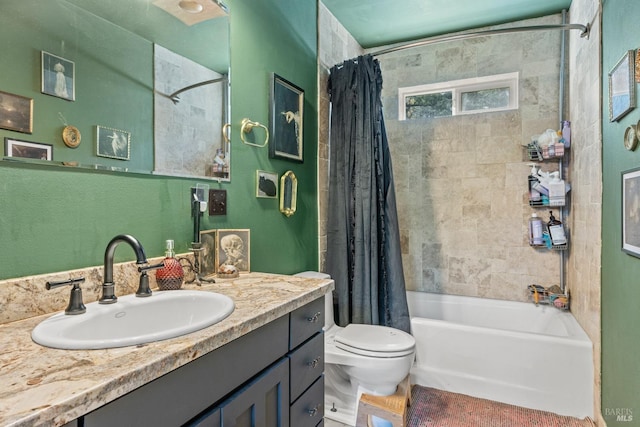 full bath with toilet, shower / bath combo with shower curtain, and vanity