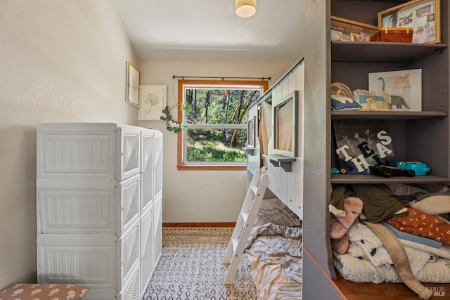 bedroom featuring baseboards