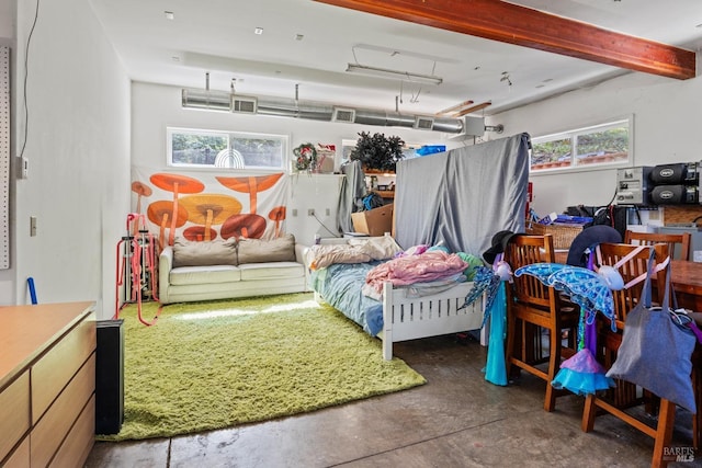 bedroom with concrete floors and visible vents