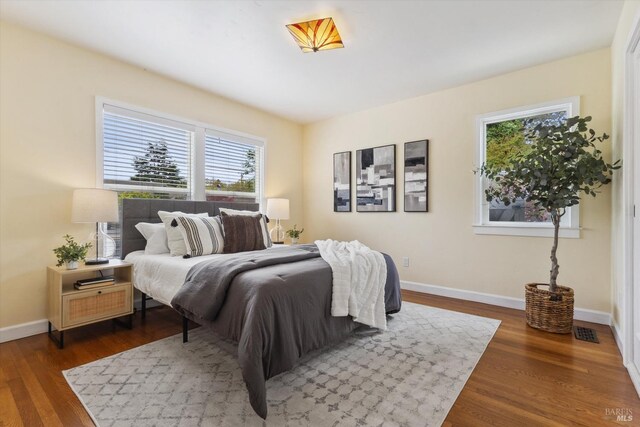 705 5th St, Petaluma, CA 94952 - bedroom with multiple windows, baseboards, and wood finished floors