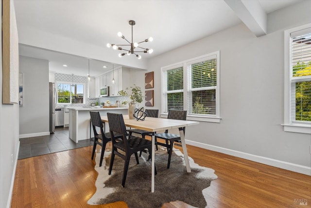 705 5th St, Petaluma, CA 94952 - dining room with dark wood-type flooring, an inviting chandelier, and baseboards