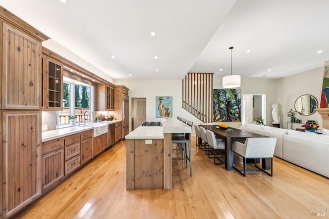 999 Pratt Ave, Saint Helena, CA 94574 - kitchen featuring a breakfast bar area, light wood finished floors, dishwasher, and a sink