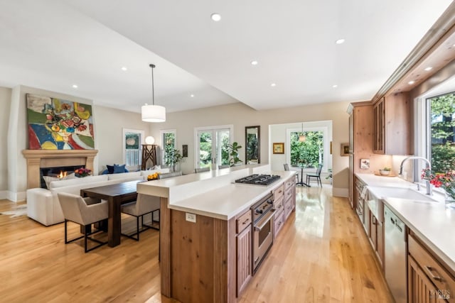 999 Pratt Ave, Saint Helena, CA 94574 - kitchen featuring brown cabinetry, a sink, light countertops, and stainless steel appliances