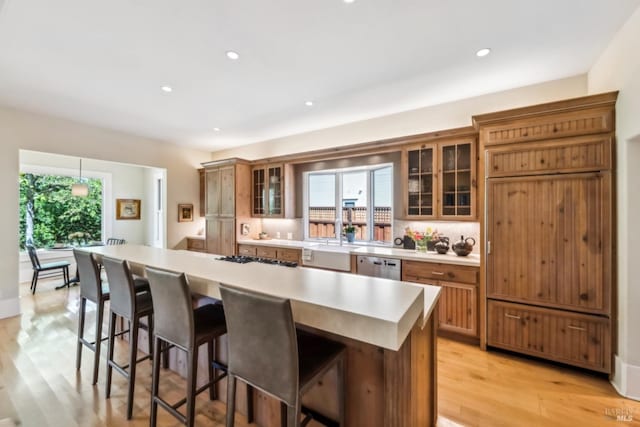 999 Pratt Ave, Saint Helena, CA 94574 - kitchen featuring a breakfast bar, a center island, light countertops, gas stovetop, and dishwasher