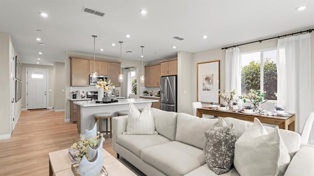 3916 Valance Way, Rancho Cordova, CA 95742 - living room with recessed lighting, healthy amount of natural light, light wood-style floors, and baseboards