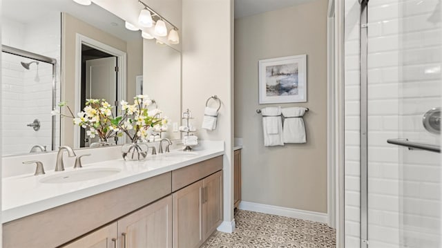 3916 Valance Way, Rancho Cordova, CA 95742 - bathroom featuring a shower with door, baseboards, double vanity, and tile patterned floors