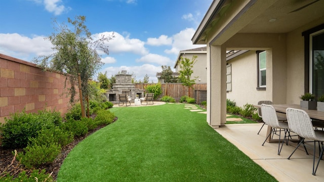 3916 Valance Way, Rancho Cordova, CA 95742 - view of yard featuring exterior fireplace, a patio area, and outdoor dining area