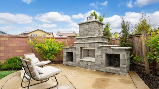 3916 Valance Way, Rancho Cordova, CA 95742 - view of patio / terrace with an outdoor stone fireplace and a fenced backyard