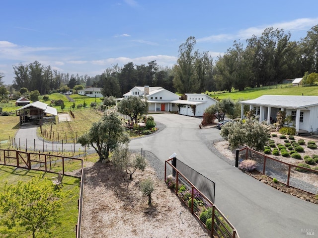 9123 Red Hill Ct, Cotati, CA 94931 - view of front of property with view of wooded area, a garage, and driveway
