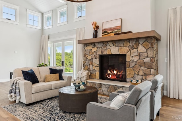 9123 Red Hill Ct, Cotati, CA 94931 - living room with wood finished floors, a stone fireplace, and high vaulted ceiling