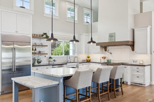 9123 Red Hill Ct, Cotati, CA 94931 - kitchen with stainless steel appliances, a towering ceiling, healthy amount of natural light, and white cabinetry