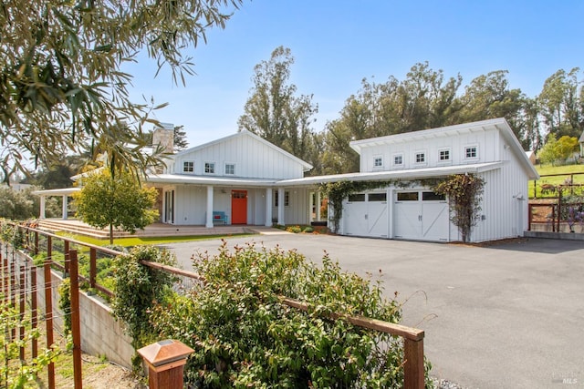 9123 Red Hill Ct, Cotati, CA 94931 - modern inspired farmhouse featuring driveway, covered porch, an attached garage, and board and batten siding