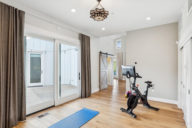 9123 Red Hill Ct, Cotati, CA 94931 - exercise area with light wood-style flooring, a barn door, and recessed lighting