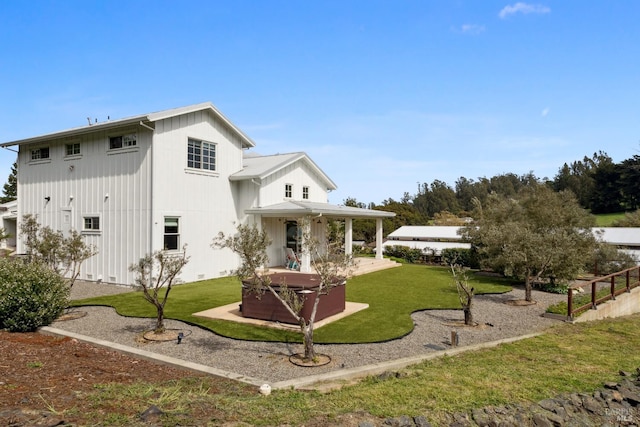 9123 Red Hill Ct, Cotati, CA 94931 - rear view of house featuring a lawn, a patio, and board and batten siding