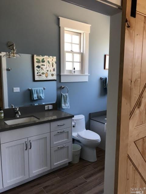 9123 Red Hill Ct, Cotati, CA 94931 - bathroom featuring vanity and wood finished floors