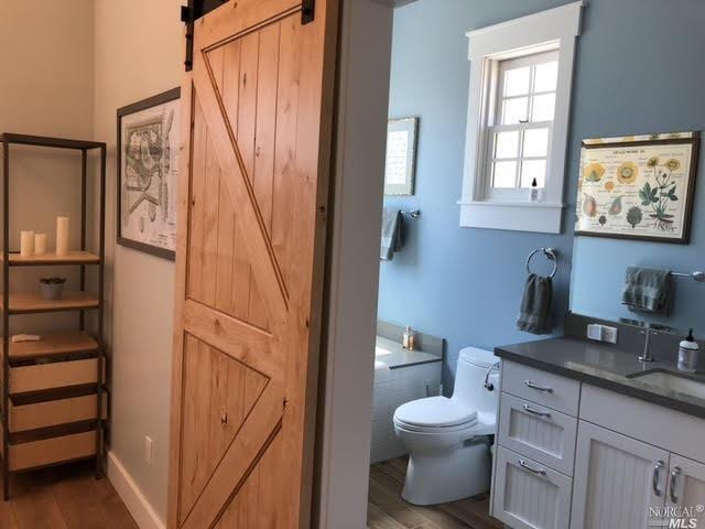 9123 Red Hill Ct, Cotati, CA 94931 - bathroom featuring vanity and wood finished floors