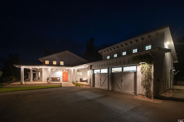 9123 Red Hill Ct, Cotati, CA 94931 - view of front facade featuring driveway, a garage, and board and batten siding