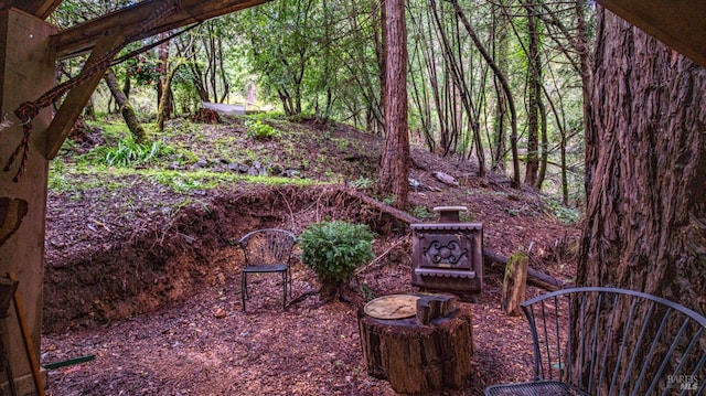 view of yard with a view of trees