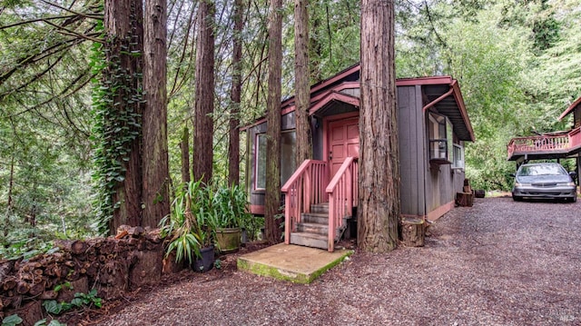 view of outdoor structure featuring a wooded view