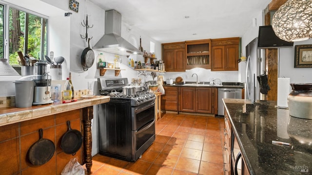kitchen featuring light tile patterned floors, open shelves, exhaust hood, appliances with stainless steel finishes, and brown cabinets