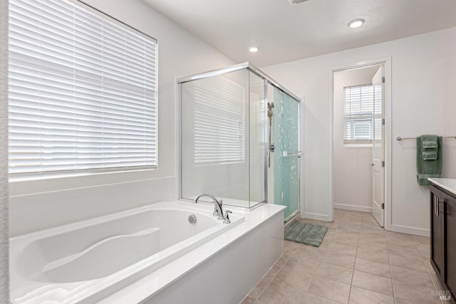 bathroom featuring a bath, a shower stall, vanity, tile patterned floors, and recessed lighting