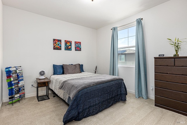 carpeted bedroom with baseboards