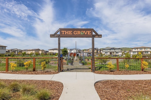 surrounding community with a residential view and fence