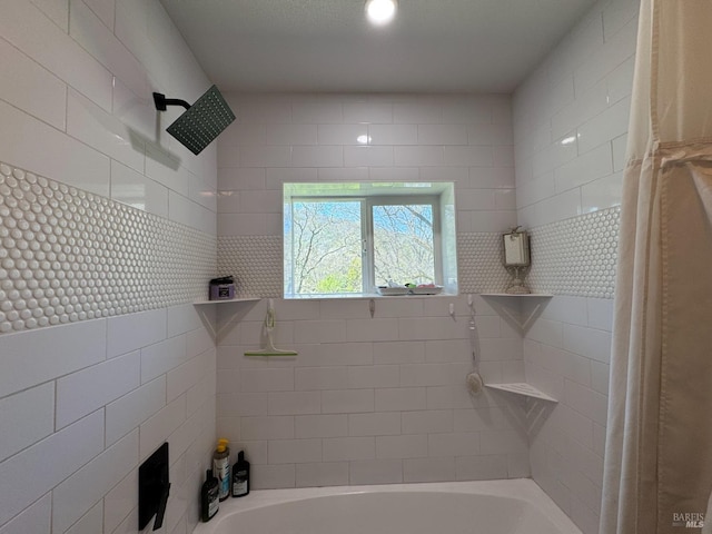 full bath featuring tiled shower / bath combo
