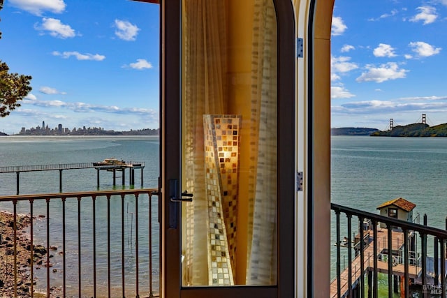 balcony featuring a water view