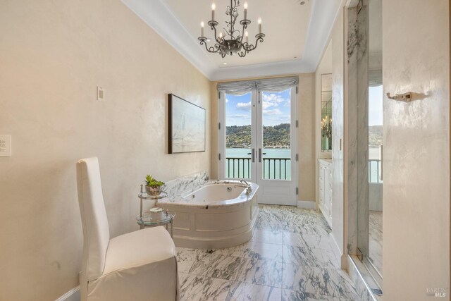 full bath with a garden tub, a stall shower, french doors, baseboards, and a notable chandelier